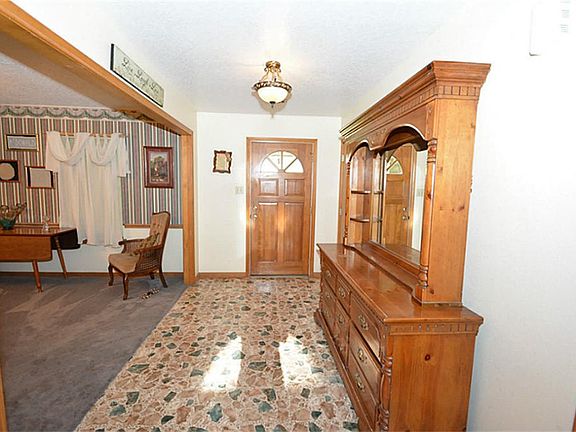 LARGE ROOMY FRONT ENTRY WAY. WITH HALL CLOSET TO THE RIGHT (THE DRESSER IS ON THE WAY OUT) AND FORMA