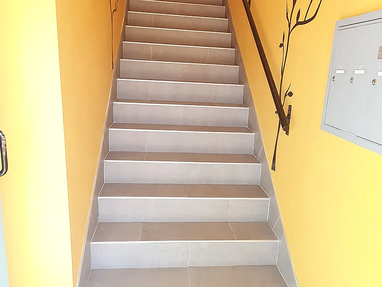 Stairs from street level to upper level where unit is located