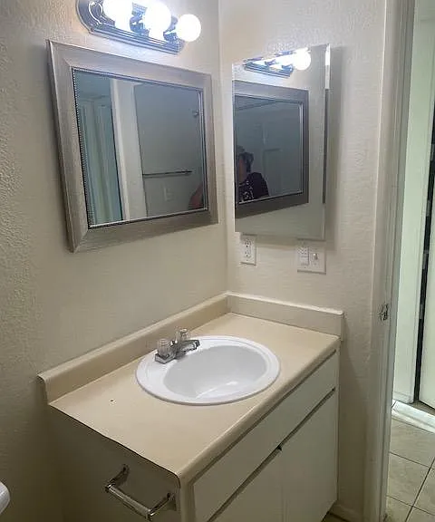 New medicine cabinet, mirror and light fixture