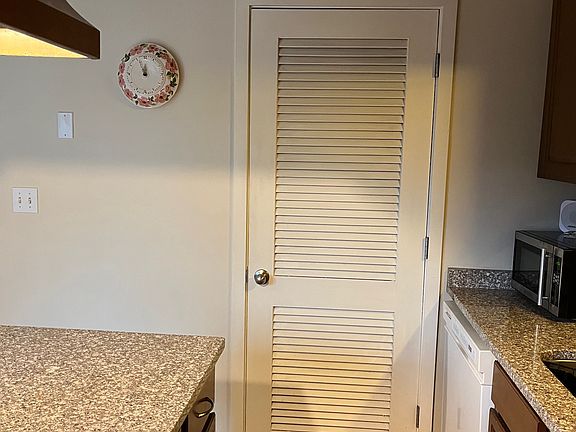 Utility closet located just off the kitchen