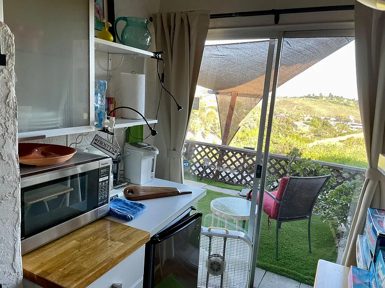 Microwave, coffee, pot, and refrigerator in second bedroom