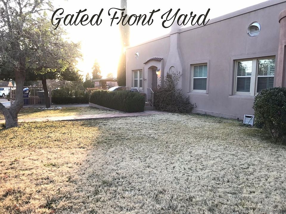 Front yard is enclosed. Sitting porch area