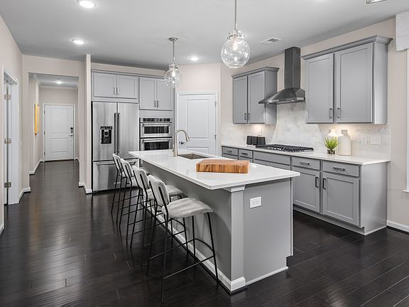 Gray Cabinetry with Under Cabinet Lighting in the Gourmet Kitchen