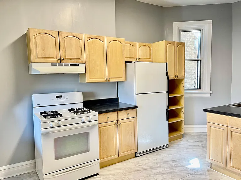 Kitchen cabinets, stove and refrigerator