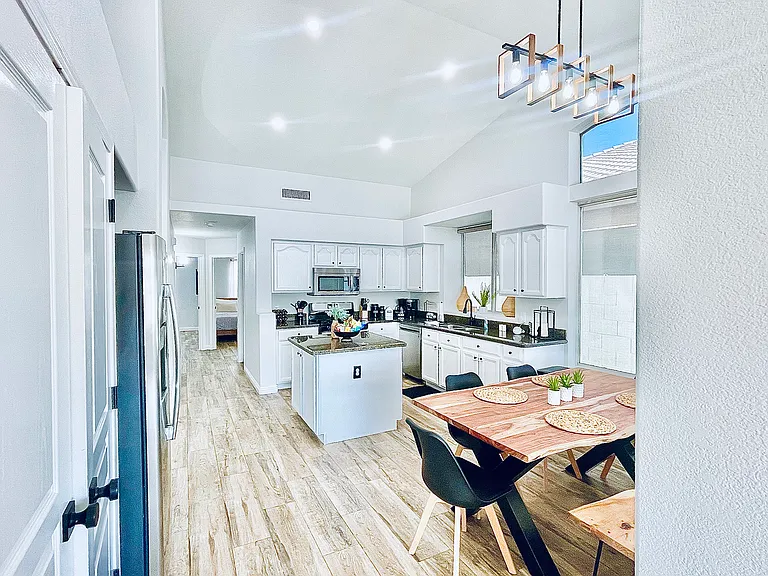 Fully stocked kitchen with dining table