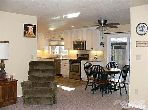 View from the living room into the kitchen and dining area.
