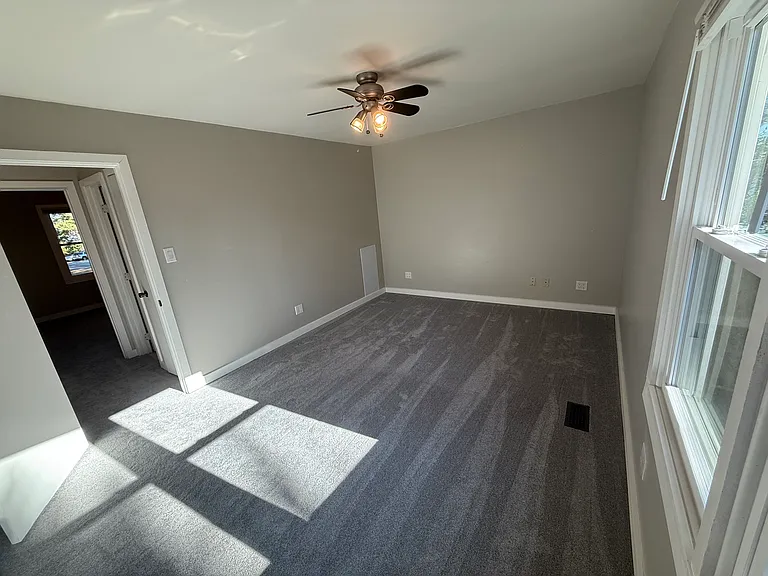 Back bedroom to hallway
Ceiling fans in all bedrooms
Agreeable gray throughout with gloss white trim