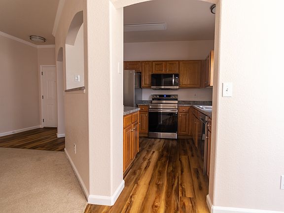 Entry into kitchen from dining room. Area to left is view of front door area.