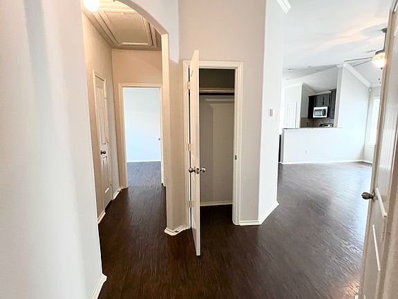 Coat closet, 2 bedrooms 1 bathroom to left, master bed and bath, kitchen, dining, laundry to right.