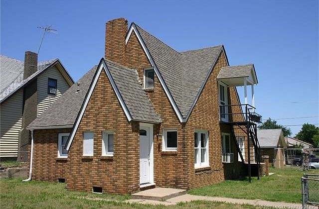 Full brick bungalow duplex.  One unit on bottom, the other up the staircase on top.