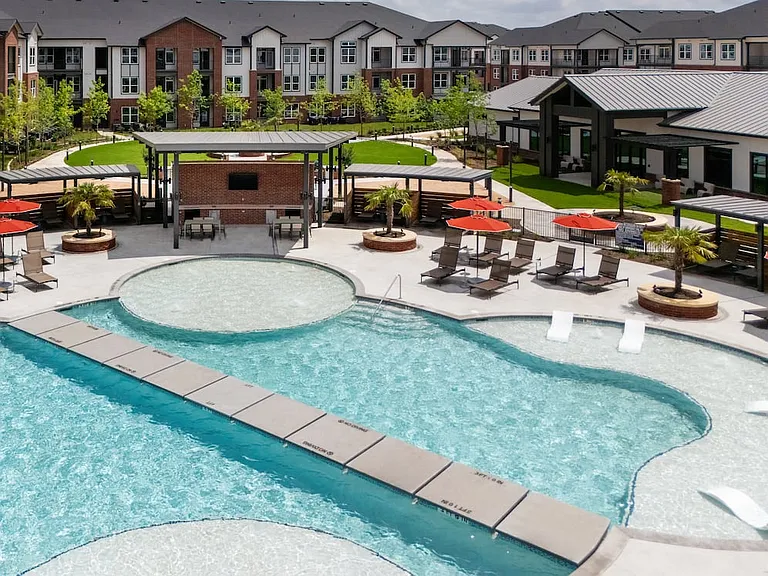 Resort-style pool with poolside lounge and cabanas