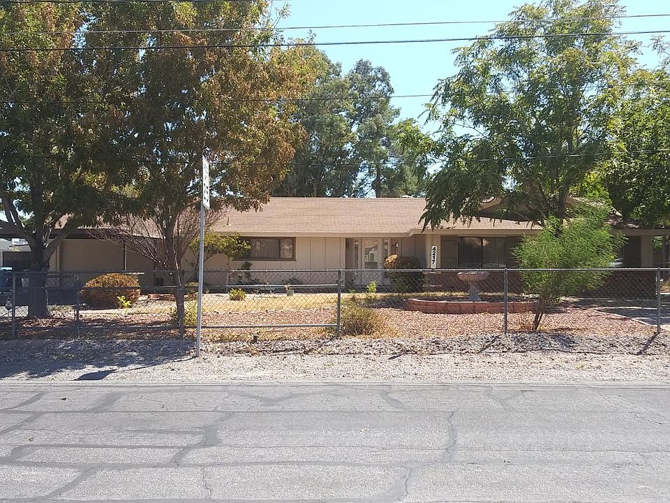 Fully fenced front yard with roll-back gate.