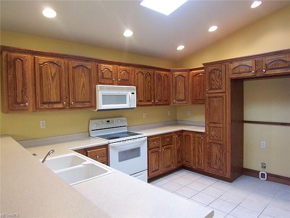 Lots of counter tops space, electric range, microwave, dishwasher and disposal.  Also the house has central vac system.
