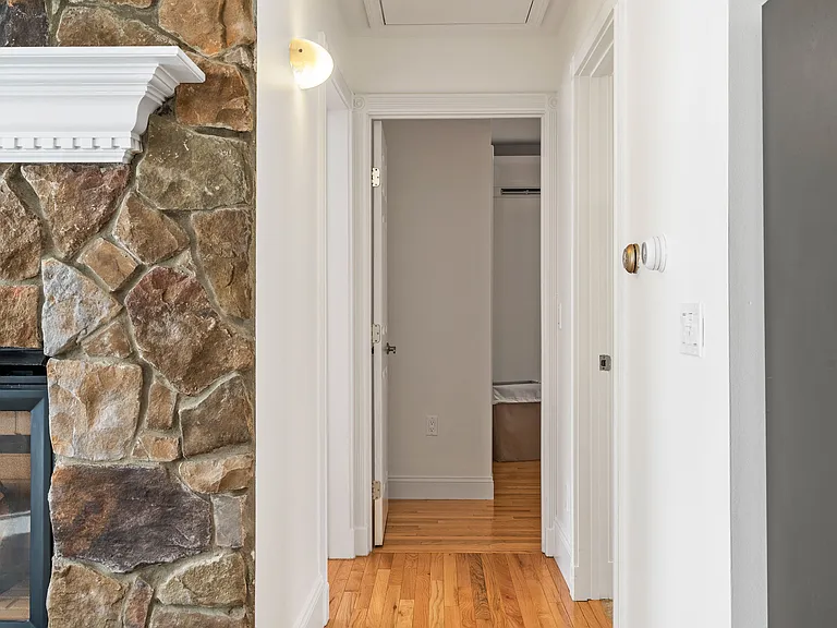 Wood Flooring, Entryway, Closet Access, Recessed Lighting, White Trim, Neutral Paint.