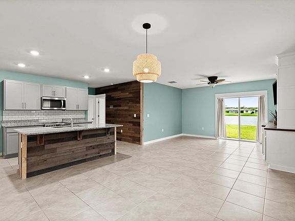 Custom woodwork on kitchen island and accent wall
