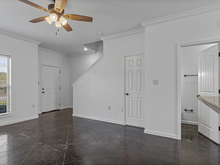 Living Room and Downstairs Bathroom| Deerfield Crossing | Townhome