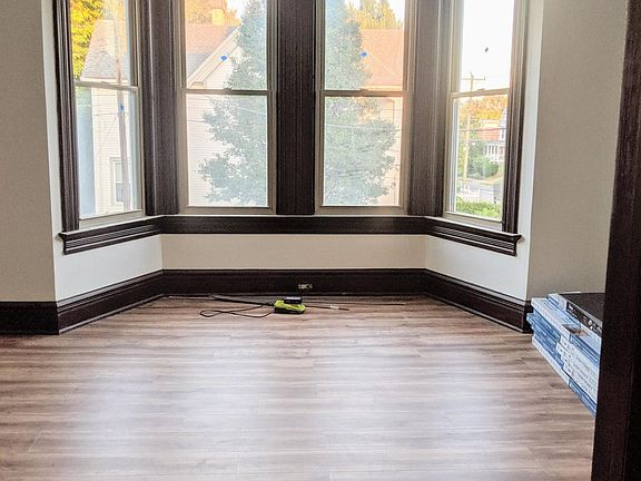 Big bay windows with original molding detail. Faces a huge tree across the street, so lots of privacy!