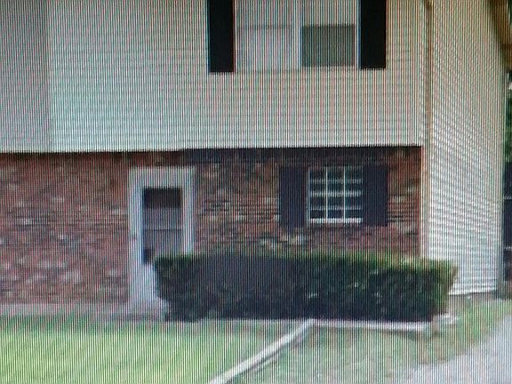 Front view (bushes have been removed and replaced with white landscape stone)