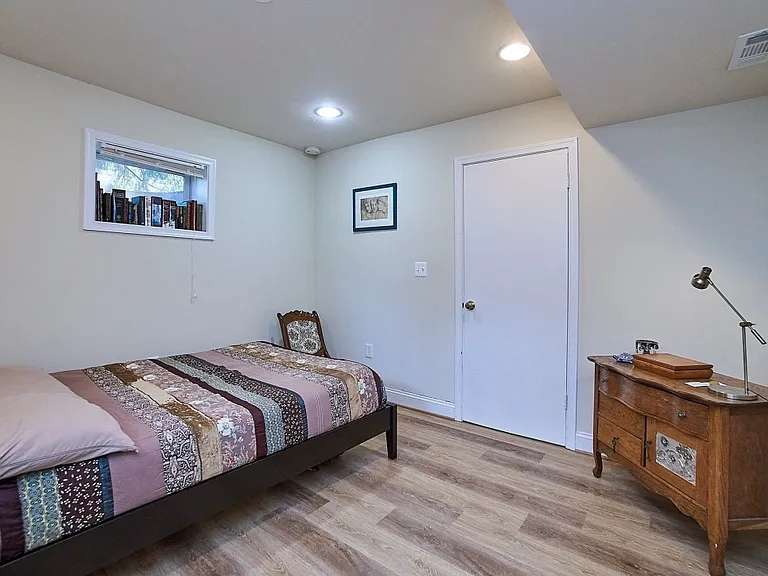2nd bedroom with closet and two windows. New paint and luxury plank floors.