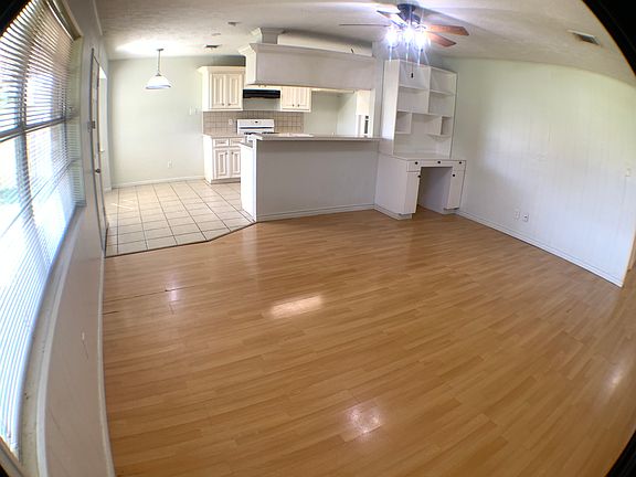 Open floor plan connecting the living room and kitchen.