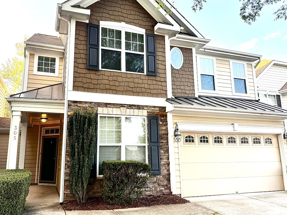 This spacious town home features a 2car garage, close to all, walk to shopping, but peace and quiet, with a large back lawn. (only connected by storage units between homes).