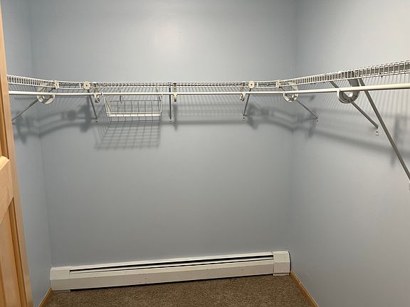 Walk-in closet in primary bedroom
