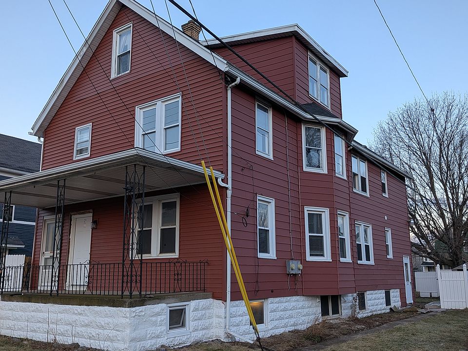 New exterior doors and siding at front.