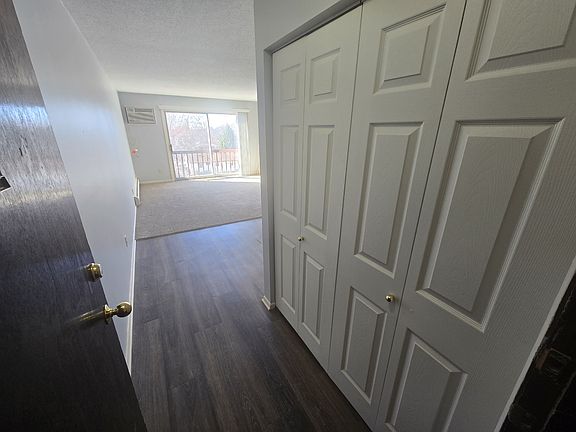 Entry to unit with a convenient coat closet and intercom behind the door.