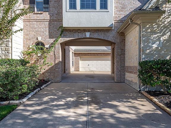 A 3-car garage located to the right of the home is enhanced by a porte-cochÃ¨re and courtyard providing plenty of room for guest parking.