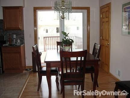 Large bay window with 2 side cranks and custom blinds.