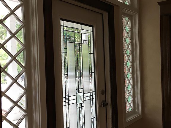 The entire building is flooded with natural light. Image taken from door of the unit looking out to the foyer.
