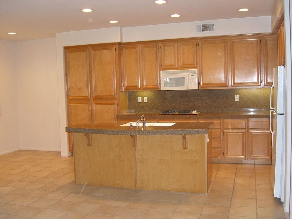 Kitchen with Granite counters, Opens to breakfast nook and family room.