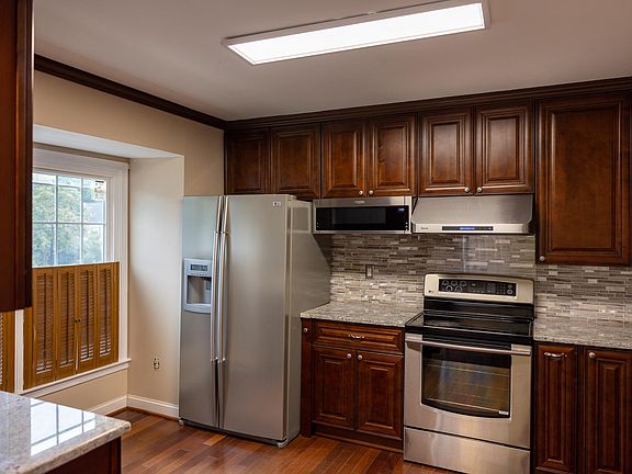 Kitchen has a bump out window and breakfast table area.