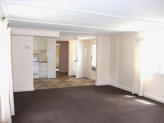 View from the spacious living room toward the kitchen.