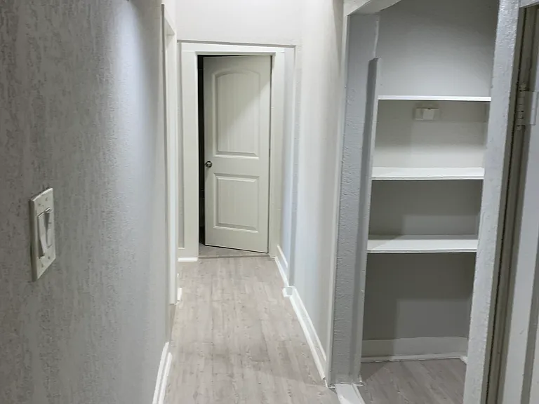 Hallway with pantry and washer/dryer connections