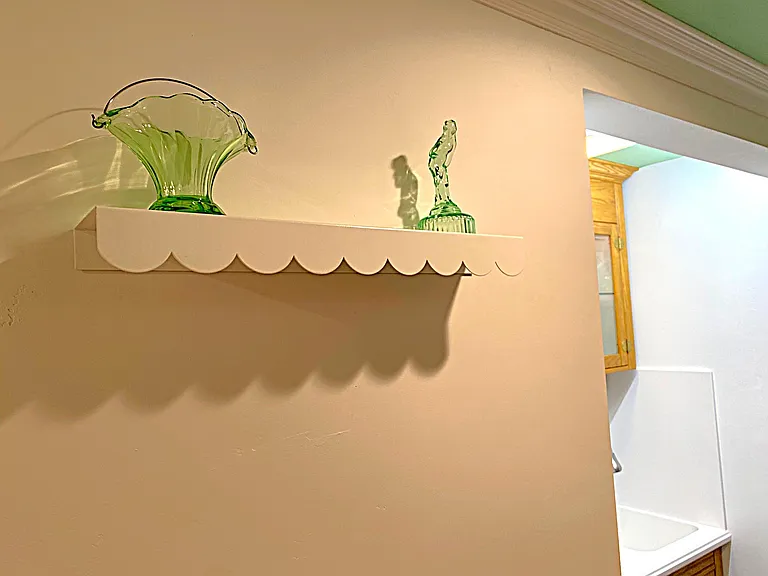 White Metal Scalloped Wall Shelf in Hallway