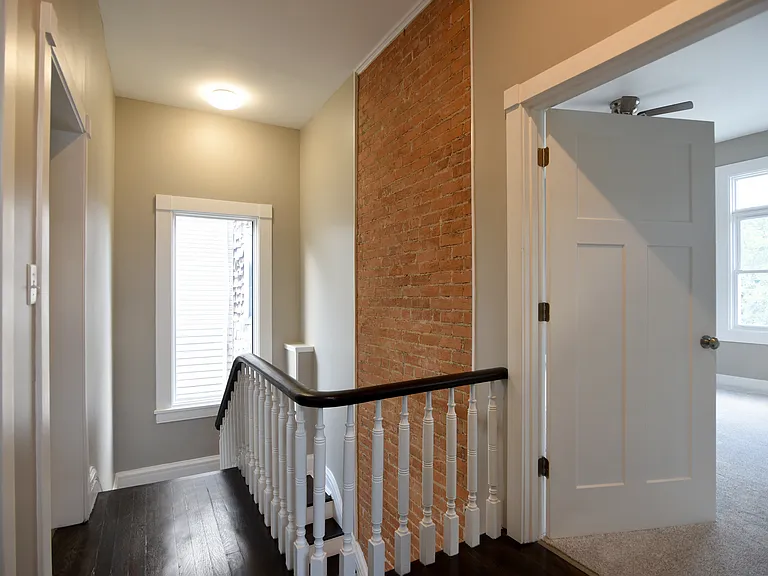 Second floor landing-entire floor has 10+ feet high ceilings. All new energy efficient tall transom windows throughout house.
Modern "Mission" doors throughout.