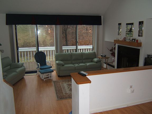Fireplace, wood floors, sliders, vaulted ceilings, skylights