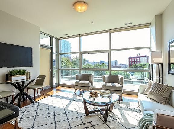 Living Room opens up to Giant Private Terrace 