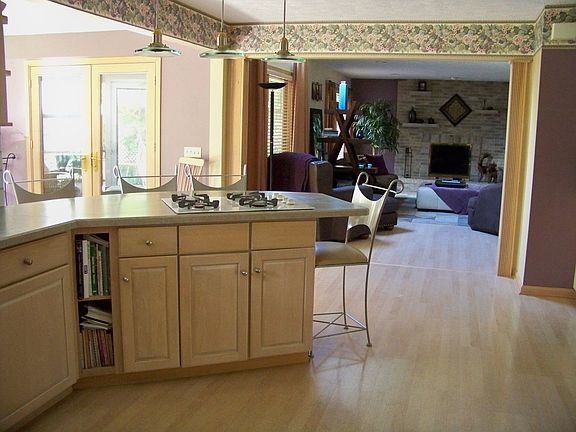 Kitchen with island open to Family Room