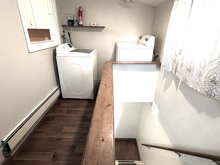 Laundry area and stairs to first floor and exit