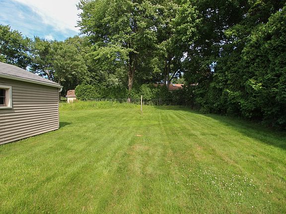 backyard great for a fire pit, grilling and yard games