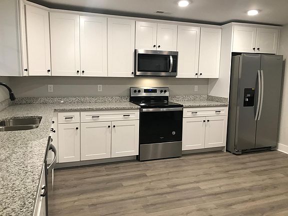 Kitchen with granite counter tops and stainless steel appliances