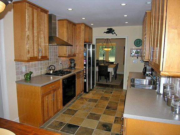 Updated Kitchen with Modern Cabinets, SS Appliances, B'fast Area & Tile Floors