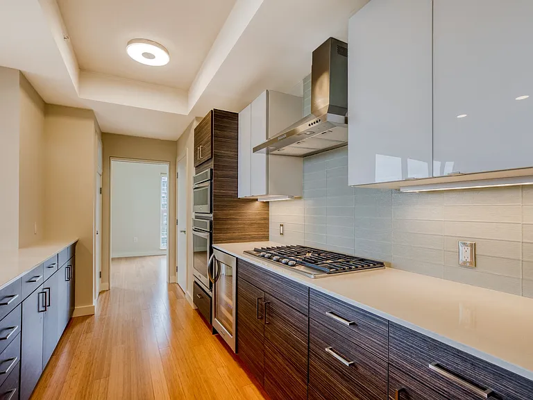 Kitchens are appointed with tile backsplashes, stainless steel appliances and gas ranges