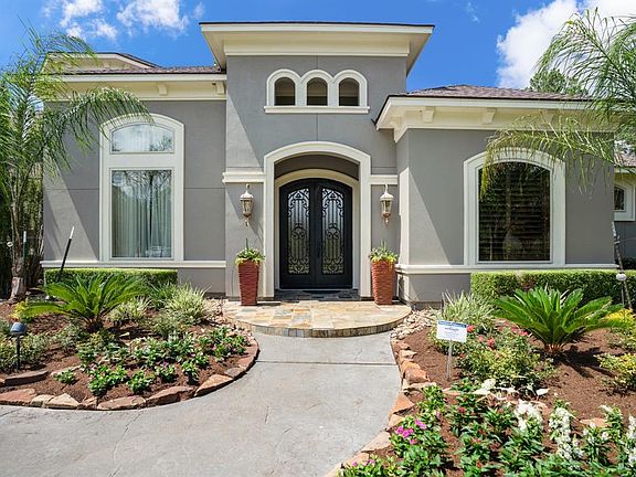 Welcome to your new masterpiece. Beautiful landscaping greet you as you walk up to the entry of the home.