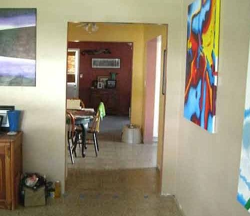 View front door looking through to kitchen and family room