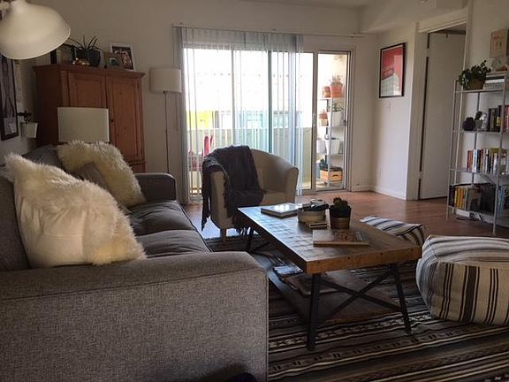 Living room looking west to balcony and hallway