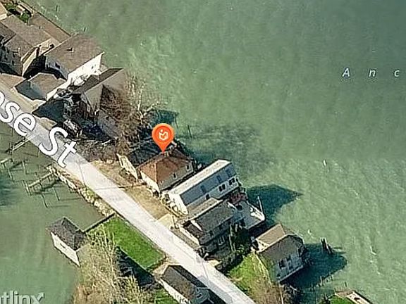 Home has the red dot over it. Water on both sides of the street