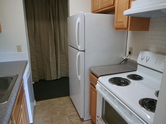Kitchen with newer appliances: Refrigerator, Dishwasher and 